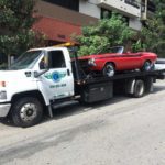 Los Angeles Towing service towing a red car