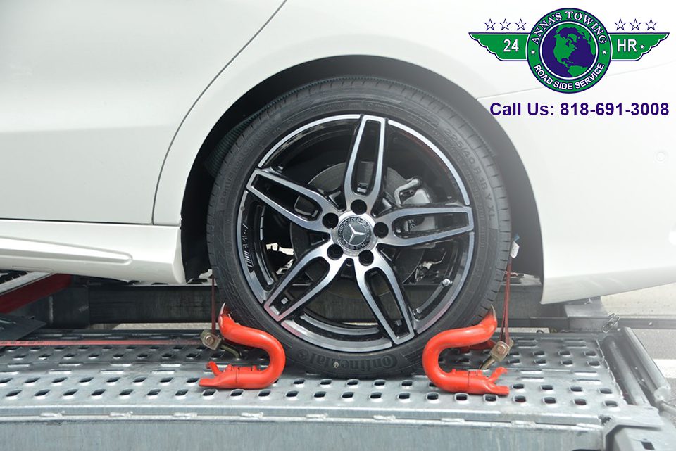 Valley-Village-Towing Car wheel secured on tow truck platform.
