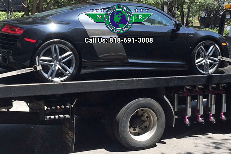 West-Hollywood-Towing-Service-for-Any-Roadside-Assistance-You-Need A black car is being towed by a tow truck.