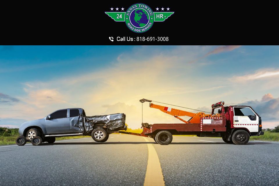 What-You-Get-from-an-Expert-Valencia-Towing-Service A tow truck towing a car on the side of a road.