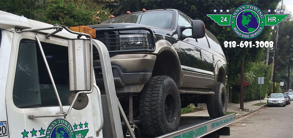 When-You-Should-Call-for-Toluca-Lake-Towing A truck is being towed by a tow truck.