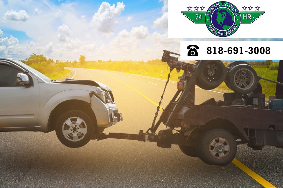 Where-to-Turn-for-Non-Emergency-Sherman-Oaks-Towing A tow truck towing a car on the side of a road.