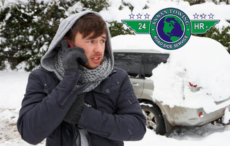 valley-village-towing-service-e1552354174148 A man in winter clothes talking on the phone.