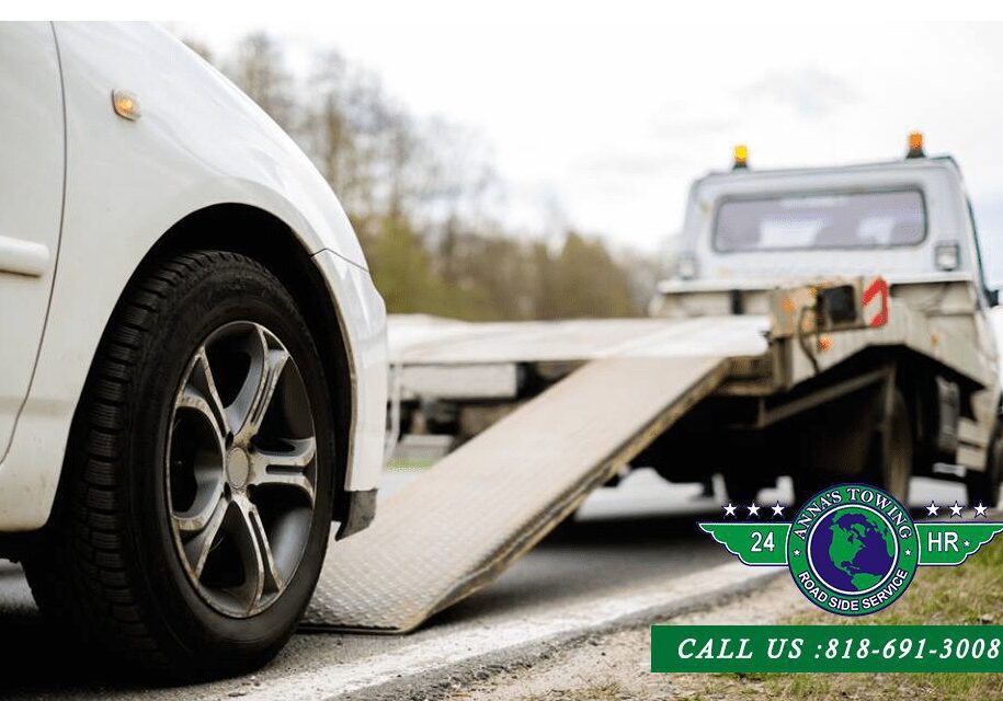 Be-Ready-For-Any-Emergency-with-Our-Reseda-Towing-Number A white car is being towed by a tow truck.