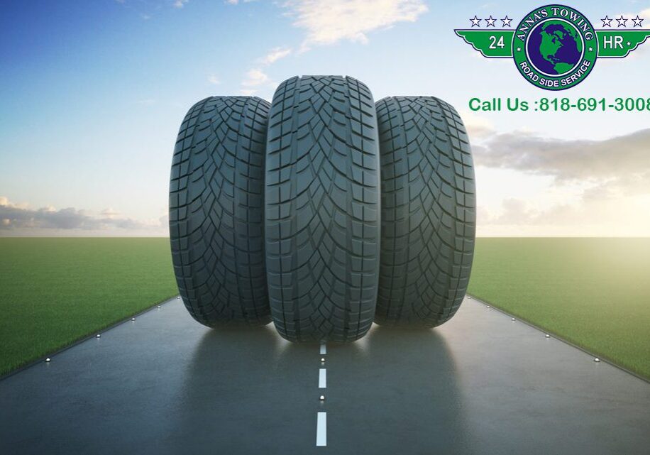 Valley-Village-Towing- Three tires on a road with the words " call us 8 5 2-4 0 1-9 3 7 6 ".