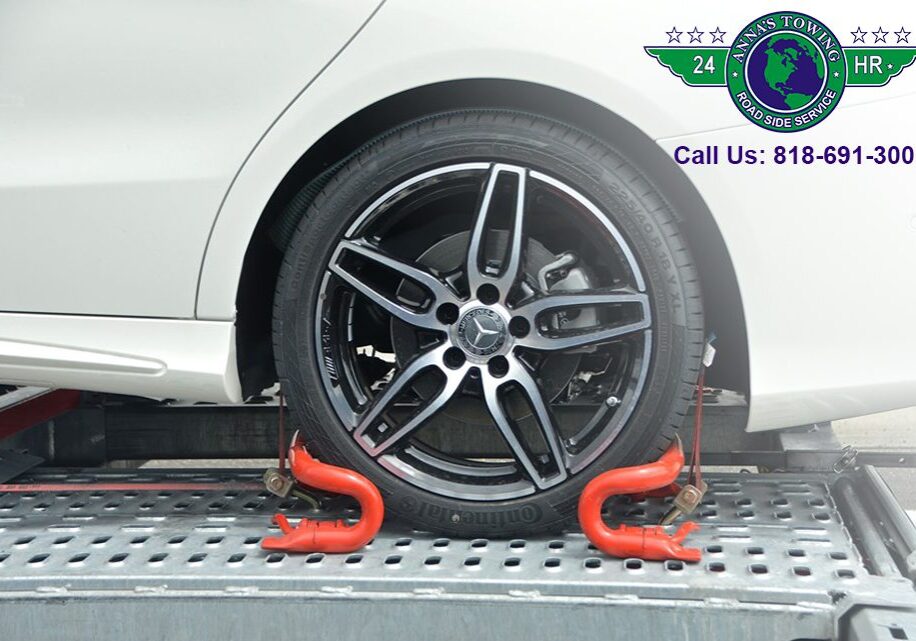 Valley-Village-Towing Car wheel secured on tow truck platform.