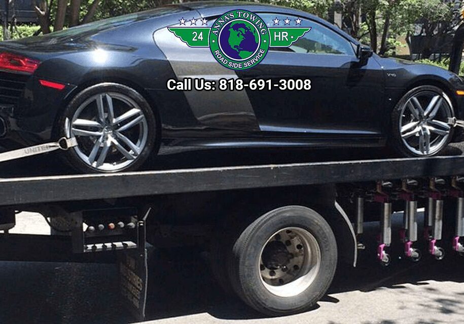 West-Hollywood-Towing-Service-for-Any-Roadside-Assistance-You-Need A black car is being towed by a tow truck.