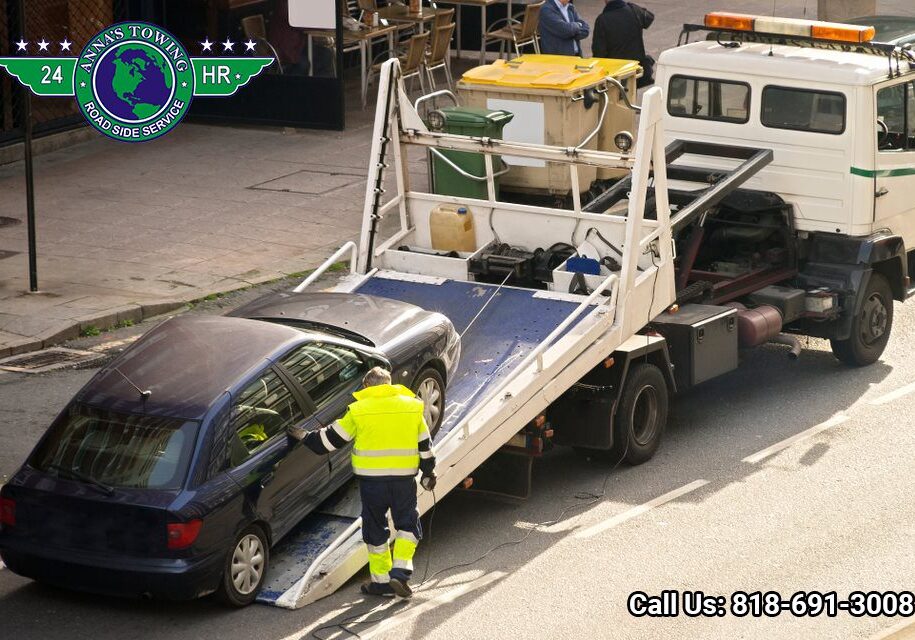 West-Hollywood-Towing-Service-for-Any-Roadside-Assistance-You-Need Tow truck loading a car onto flatbed.
