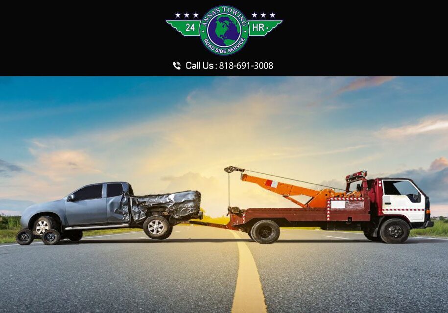 What-You-Get-from-an-Expert-Valencia-Towing-Service A tow truck towing a car on the side of a road.