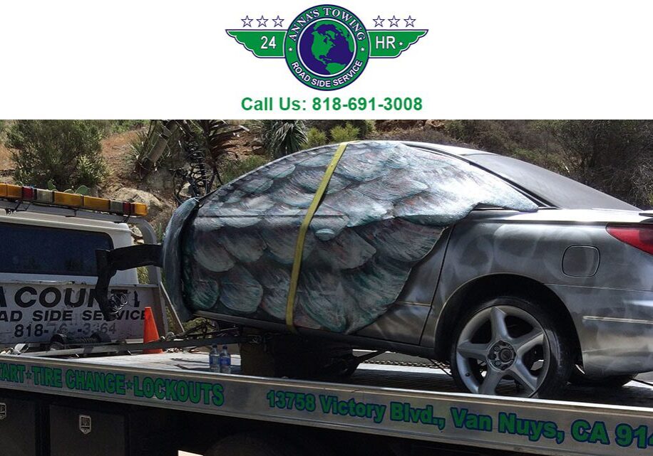 Will-Santa-Clarita-Towing Car towed on flatbed truck, roadside service.