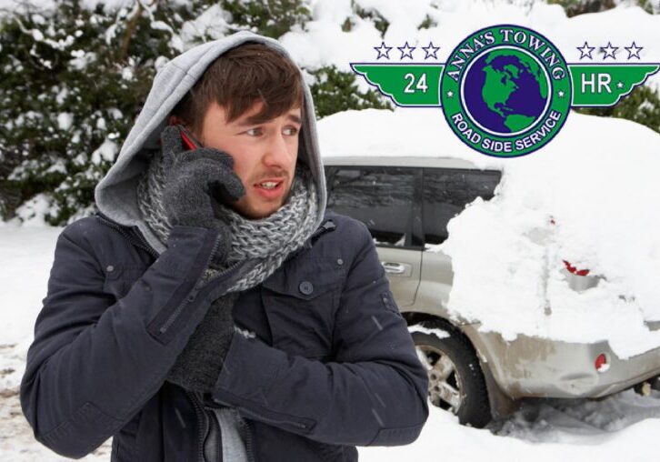 valley-village-towing-service-e1552354174148 A man in winter clothes talking on the phone.